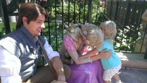 Rapunzel laughing when we told her Kella won't cut her hair because she's afraid it'll turn brown. Also, look at that crazy hair on Kella.